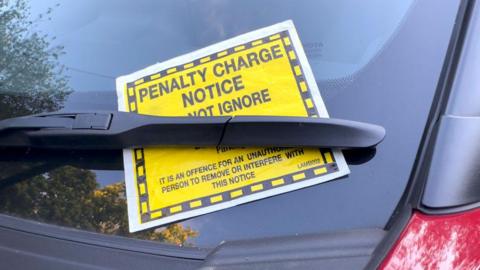 Parking ticket on a windscreen