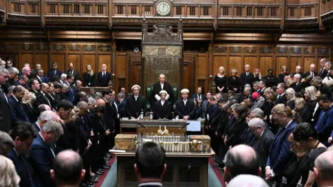UK Parliament MPs standing for a minute's silence