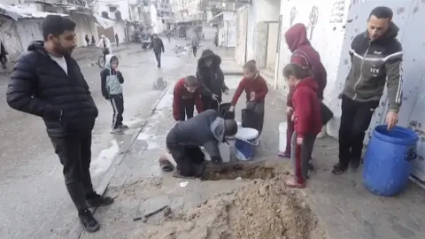 Reuters Digging for water pipes in Jabalia