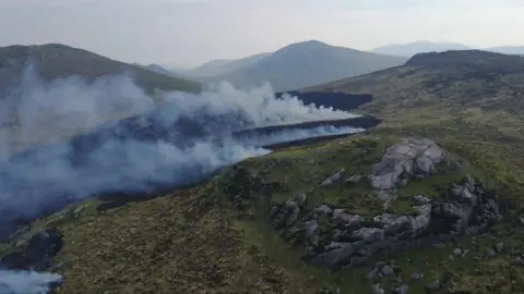 Smoke from a gorse fire in the Mourne Mountains