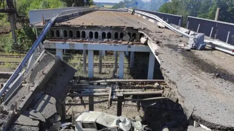 Serhiy Haidai/Luhansk regional administration A destroyed bridge near Lysychansk