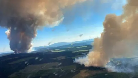 Reuters Smoke rises from a wildfire at Long Loch and Derrickson Lake in Central Okanagan, British Columbia, Canada, June 30, 2021