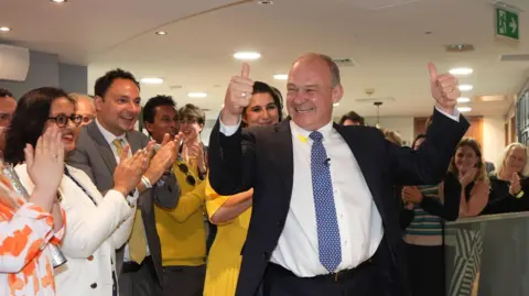 Liberal Democrat leader Sir Ed Davey is greeted by supporters as he returns to Lib Dems HQ in central London following the result of the 2024 general election