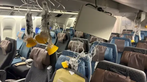 The interior of Singapore Airline flight SQ321 is pictured after an emergency landing at Bangkok's Suvarnabhumi International Airport, Thailand