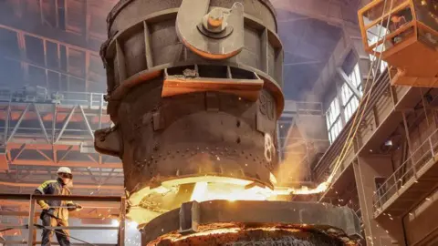 A steel worker working in a steel plant