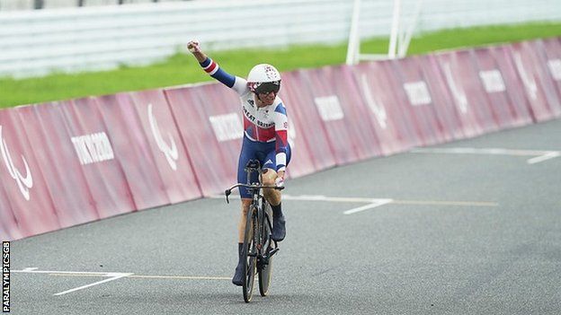 Sarah Storey celebrates after crossing the line