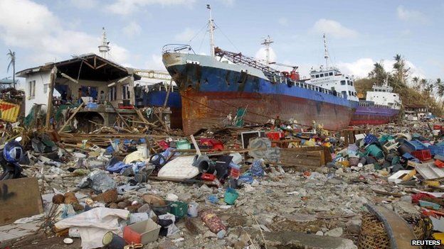 Cargo ships washed ashore are seen four days after super typhoon Haiyan hit Anibong town, Tacloban city, central Philippines November 11, 2013.