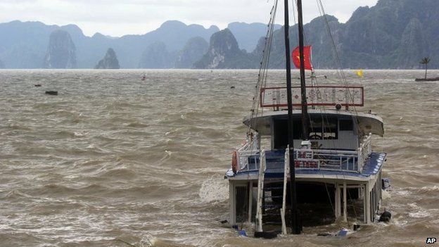 A tourist boat is seen sinking in Ha Long Bay, Vietnam on 11 November 2013