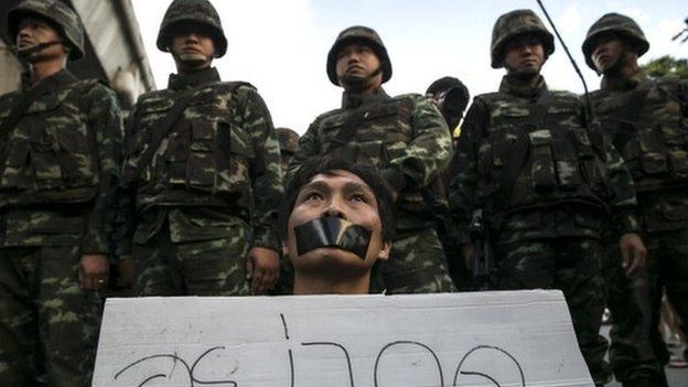 A Thai protester shows his disapproval with the military during an anti-coup protest despite the martial law 23 May 2014 in Bangkok, Thailand.