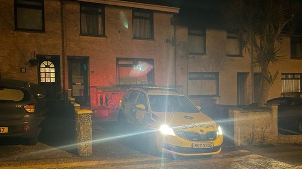 A police car outside a house on Loran Avenue in Larne