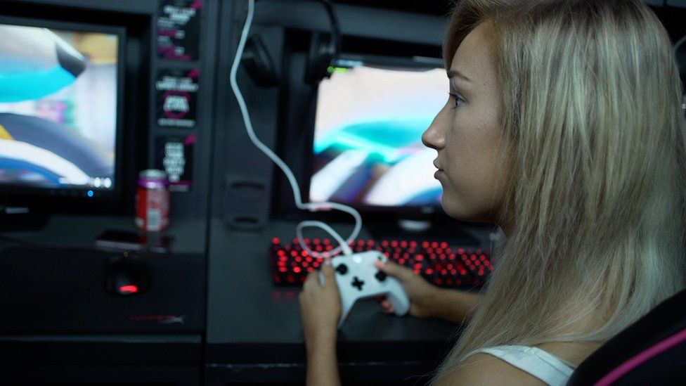 Woman playing computer game