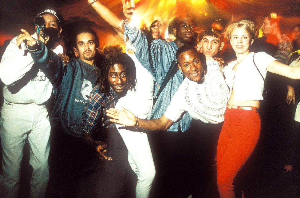 Clubbers pose for the camera at Bagleys, London, 1996