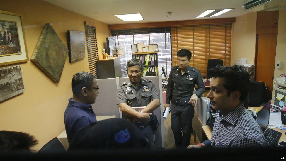 Human Rights Watch staff talk to policemen at the Foreign Correspondents Club of Thailand in Bangkok - 26 June 2015