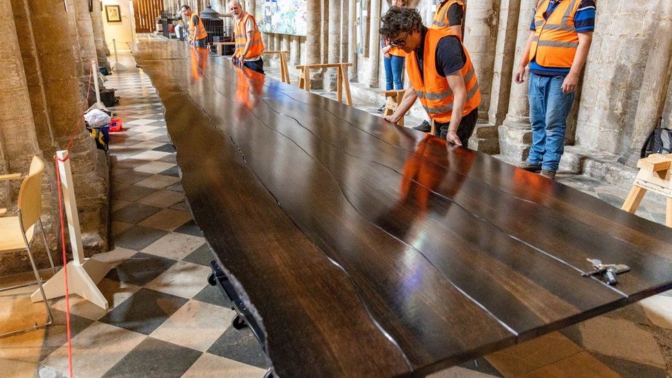 A table made from the wood of a 5,000-year-old oak tree enters Ely Cathedral
