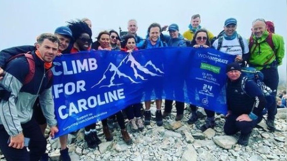 The Climb For Caroline team at the top of a peak