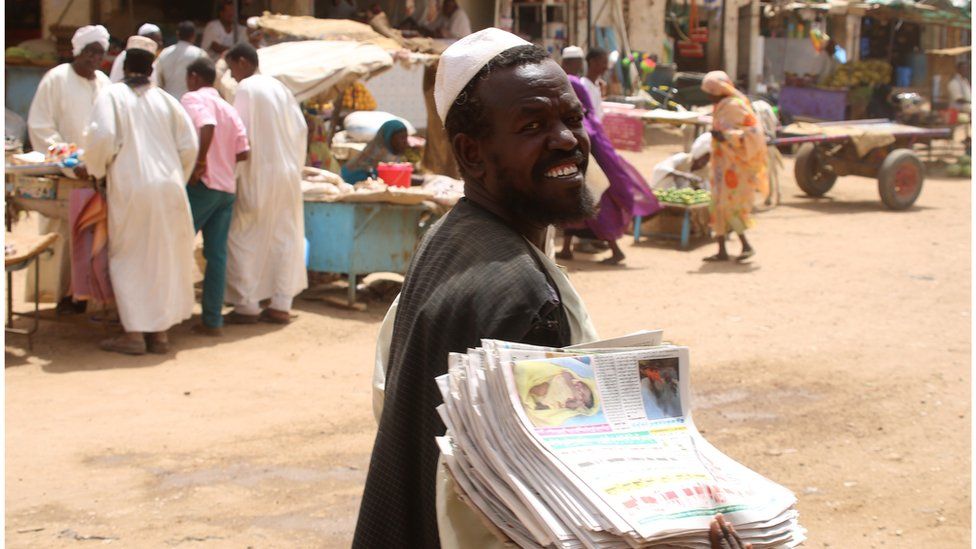 Newspaper vendor in Sudan