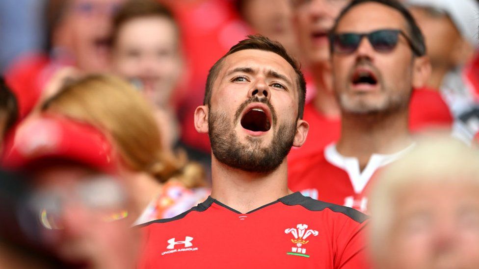 Welsh fans singing at a rugby match