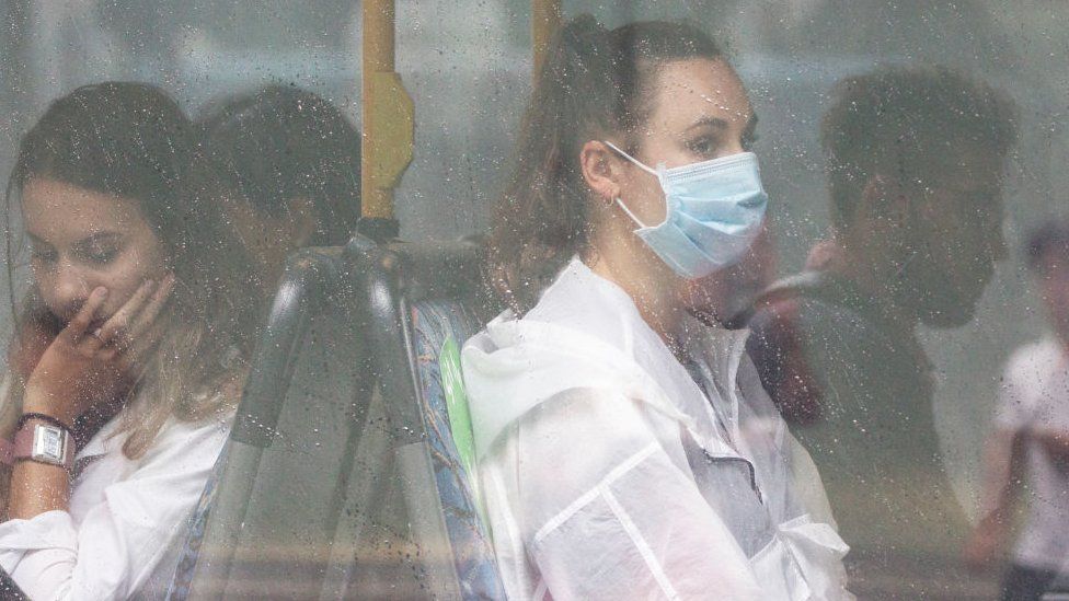 Passengers wear a mask on a Sydney bus amid a pre-Christmas outbreak of coronavirus