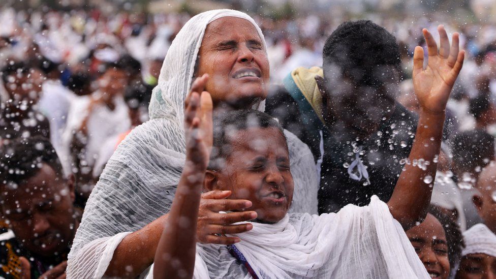 Ethiopian Orthodox faithful gets baptized during the annual Epiphany celebration called "Timket"