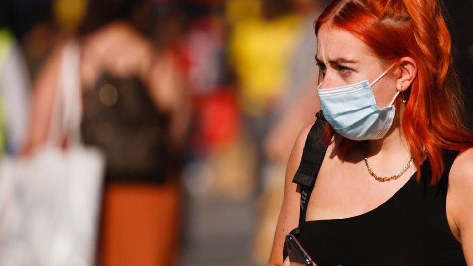 Woman on the street wearing a facemask