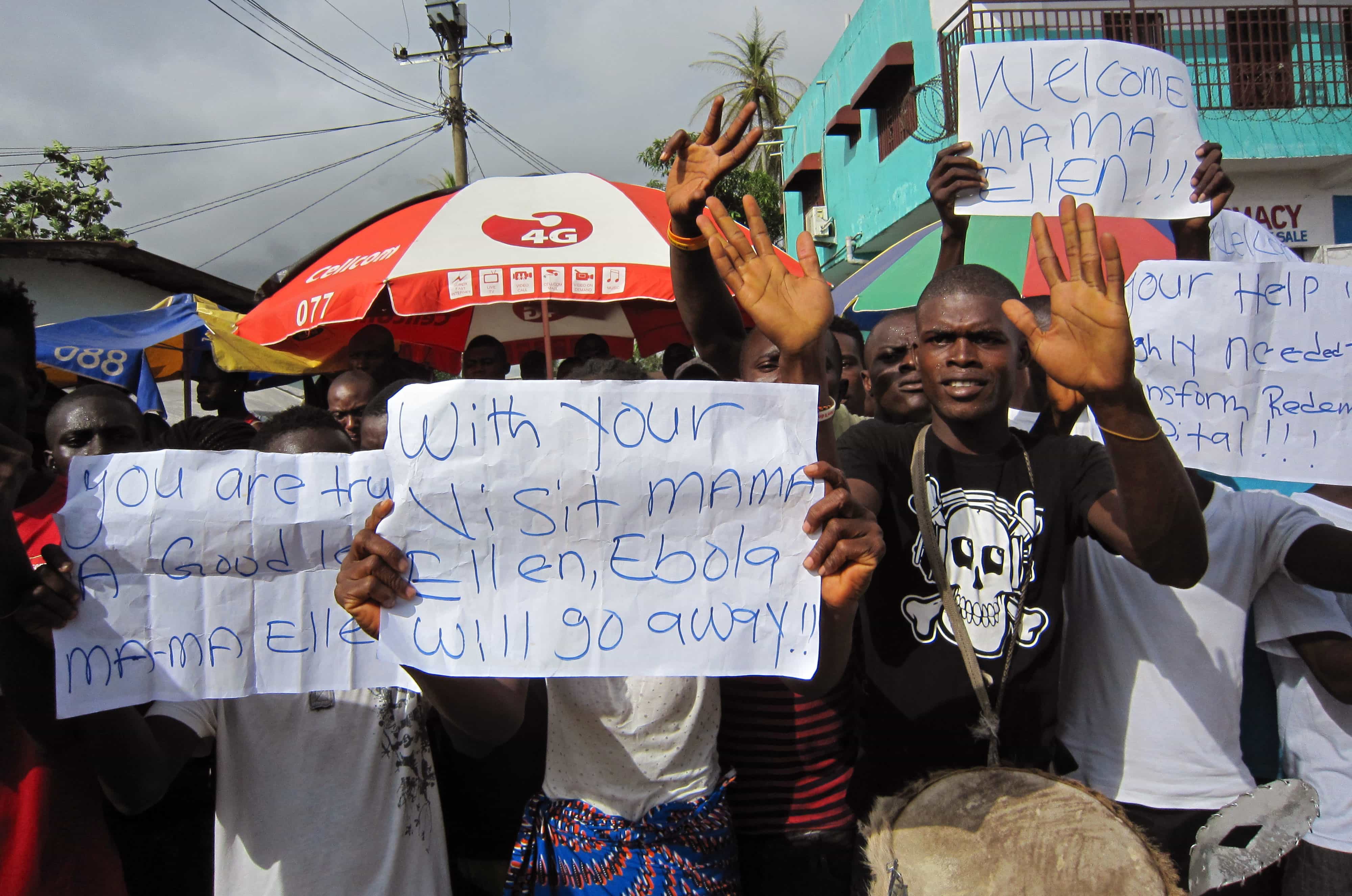 People protest outside a hospital as Liberian President Ellen Johnson Sirleaf visits the area after Ebola deaths in Monrovia, 17 June 2014., AP Photo/Jonathan Paye-Layleh, File