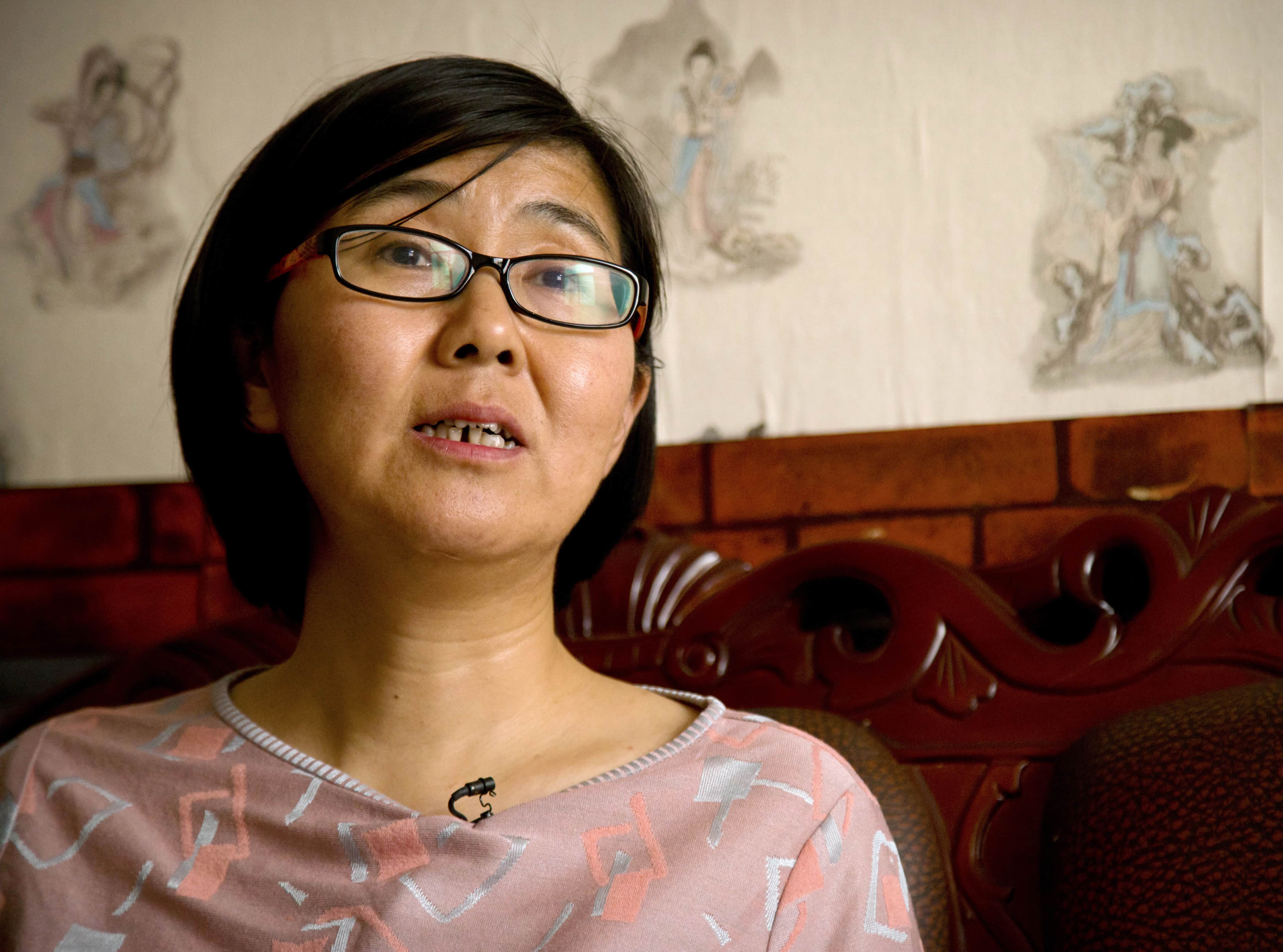 In this 18 April 2015 file photo, Wang Yu, a prominent human rights lawyer, speaks during an interview in Beijing, AP Photo/Mark Schiefelbein, File