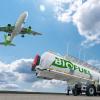 Airplane flying low over a biofuel tank