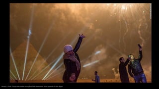 January 1, 2016: People take selfies during New Year celebrations at the pyramids in Giza, Egypt.
 