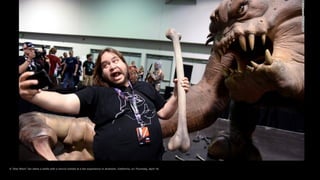 A "Star Wars" fan takes a selfie with a rancor exhibit at a fan experience in Anaheim, California, on Thursday, April 16.
 