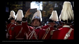 A member of the municipal police band in Barcelona, Spain, takes a selfie before playing at a charity event on Friday, December 11.
 