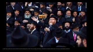 A rabbi uses a selfie stick near the Chabad-Lubavitch headquarters in New York on Sunday, November 8. Thousands of Orthodox rabbis were in town for an international conference.
 