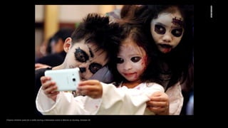 Filipino children pose for a selfie during a Halloween event in Manila on Sunday, October 25.
 