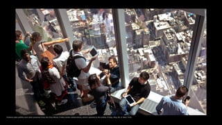 Visitors take selfies and other pictures from the One World Trade Center observatory, which opened to the public Friday, May 29, in New York.
 