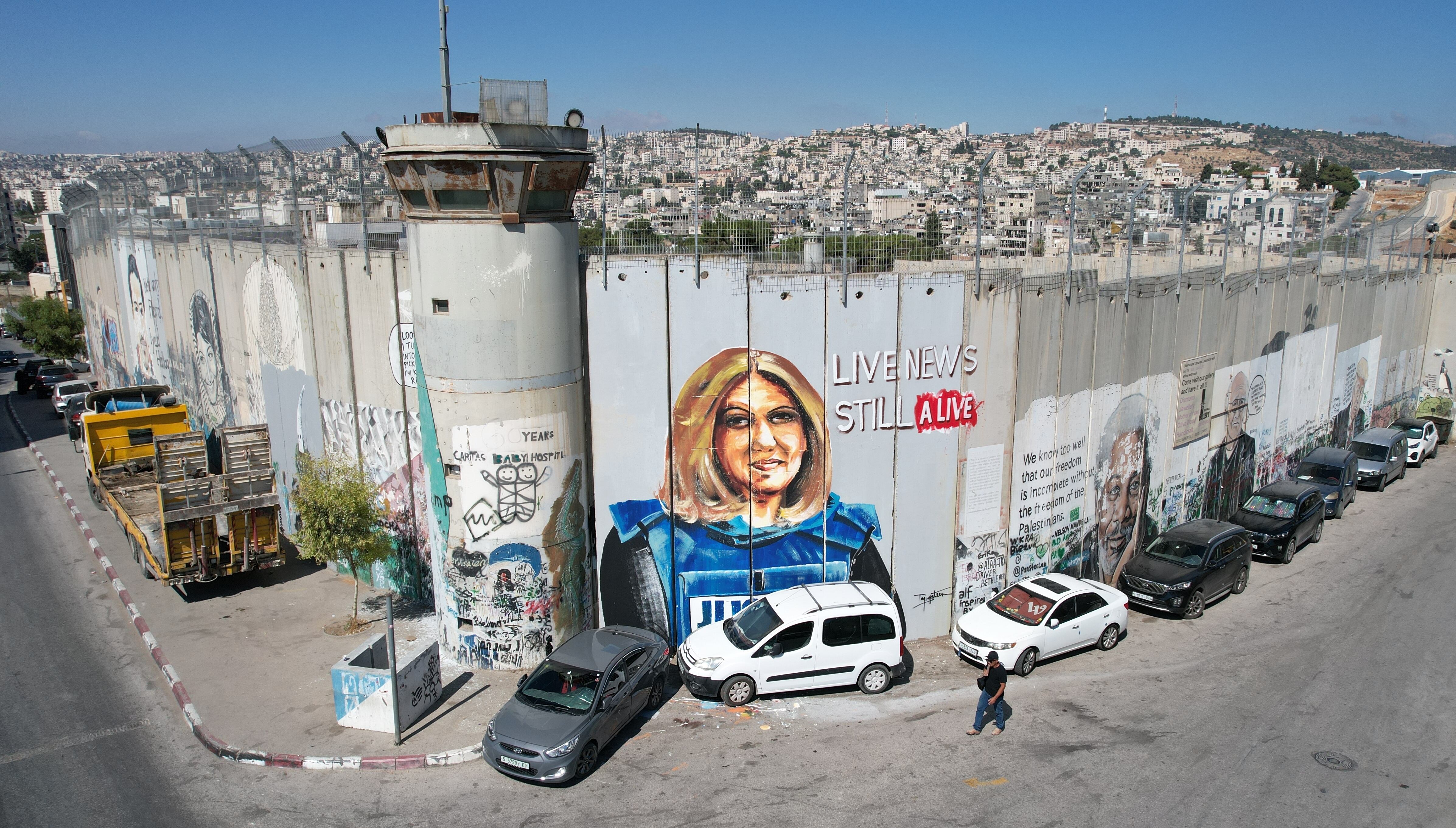 Graffiti in Bethlehem, on the wall built by Israel in the West Bank depicting journalist Shireen Abu Akleh, whose death at the hands of the Israeli military in 2022 remains unpunished.