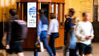 Photo shows people moving through Helsinki's central railway station.