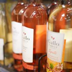 Alcohol bottles on the shelf of a retail store.