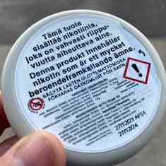 Warning label on a nicotine pouch packaging.