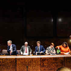 Petri Honkonen, Mats Löfström, Johannes Koskinen, Heikki Vestman, Fatim Diarra and Vilhelm Junnila sitting at a long desk.