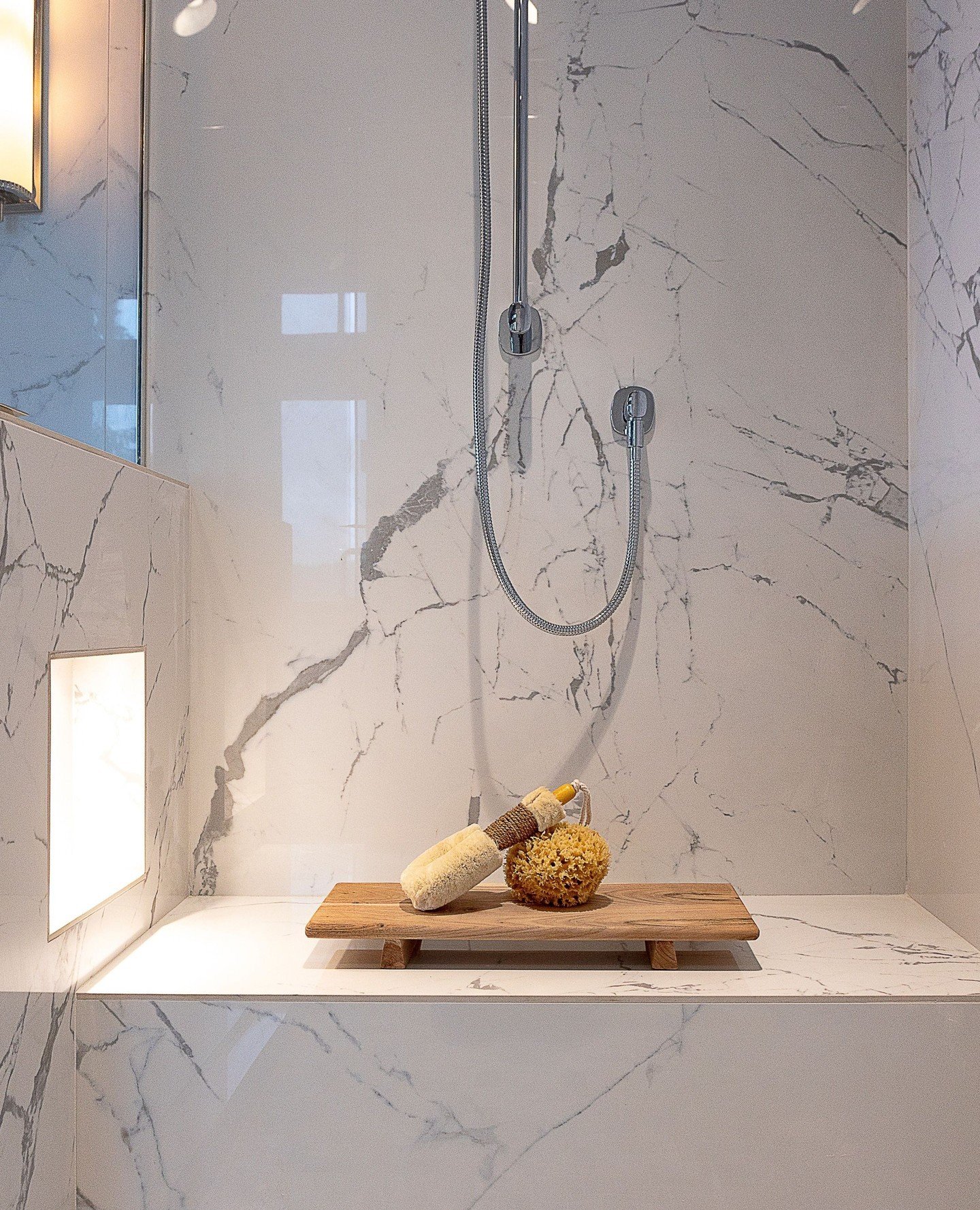 DETAILS | Porcelain has come a long way. Digital printing processes are so advanced, you'll need to touch this surface to know it's not real stone. The benefit for our clients, aside from budget, is that this durable and easy-maintenance solution shi