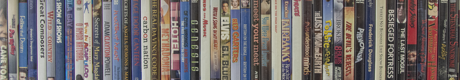 A row of various pop culture DVDs