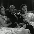 Wendy Barrie, Joan Gardner, and Roland Young in Wedding Rehearsal (1932)