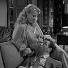 Peggie Castle and Biff Elliot in I, the Jury (1953)