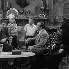 John Astin, Carolyn Jones, Frank Nelson, Kim Tyler, and Ken Weatherwax in The Addams Family (1964)