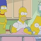 Julie Kavner, Nancy Cartwright, and Dan Castellaneta in The Simpsons (1989)