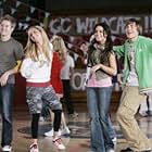 Ashley Tisdale, Vanessa Hudgens, Zac Efron, and Lucas Grabeel in High School Musical (2006)