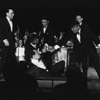 Frank Sinatra, Sammy Davis Jr., Dean Martin, Peter Lawford, Buddy Lester and Joey Bishop performing in the Copa Room at the Sands Hotel in Las Vegas