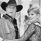 Woody Harrelson and Marg Helgenberger in The Cowboy Way (1994)