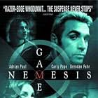 Adrian Paul and Carly Pope in Nemesis Game (2003)