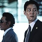 Lee Jung-jae and Hwang Jung-min in New World (2013)