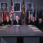 Gerald Ford, Hale Boggs, John Sherman Cooper, Allen Dulles, John J. McCloy, J. Lee Rankin, Richard B. Russell, and Earl Warren in JFK Revisited: Through the Looking Glass (2021)